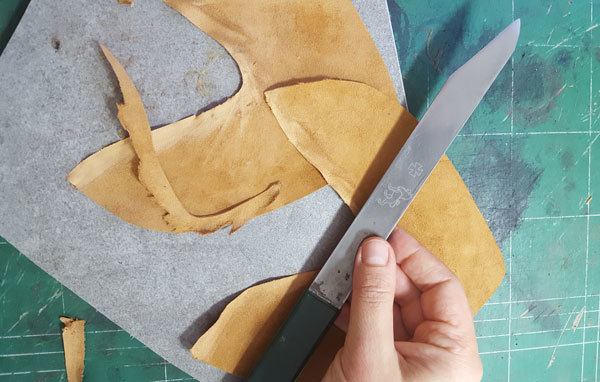 Leather-skiving Shoemaking knife and piece of leather