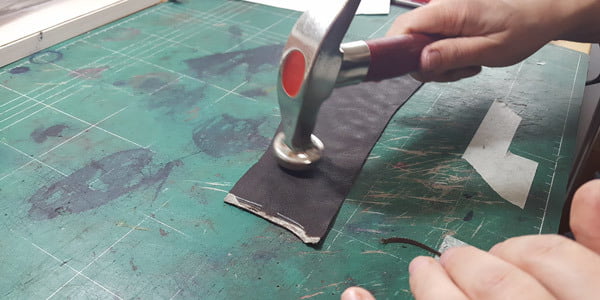 Hitting with shoemaker hammer