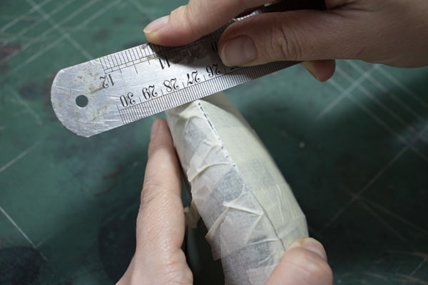 cutting the tape with ruler